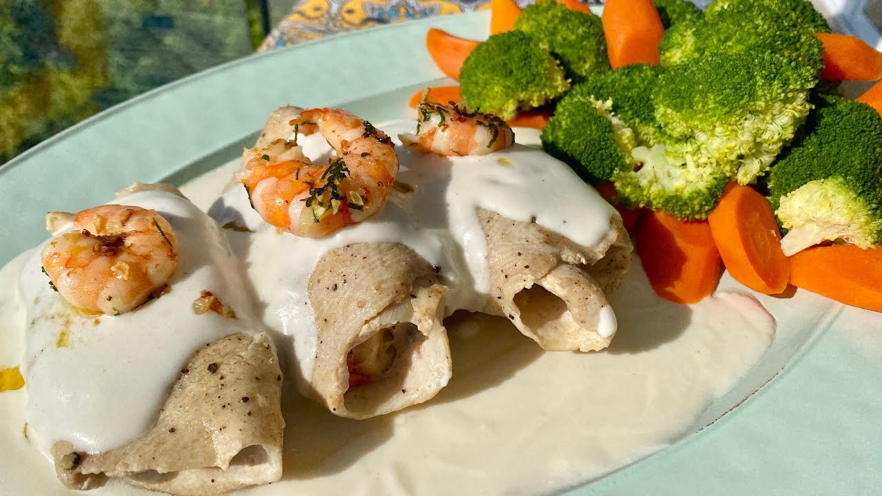 Receta de filete de pescado relleno de mariscos en salsa de queso